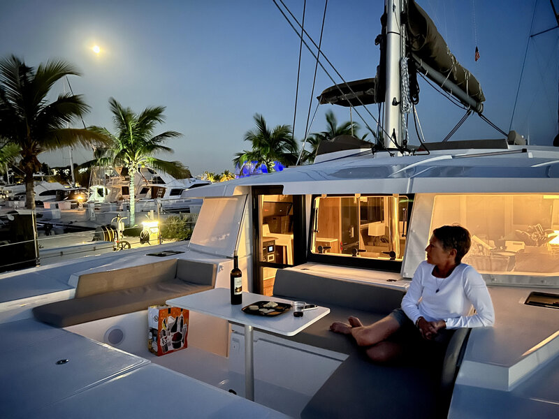 capt dave wiley yacht broker's wife camille at helm of his 2023 bali 4.2 the tamboo | The Catamaran Gurus capt dave wiley yacht broker's wife camille at helm of his 2023 bali 4.2 the tamboo