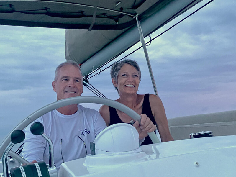 capt dave wiley yacht broker at helm of his 2023 bali 4.2 the tamboo with wife camille | The Catamaran Gurus capt dave wiley yacht broker at helm of his 2023 bali 4.2 the tamboo with wife camille
